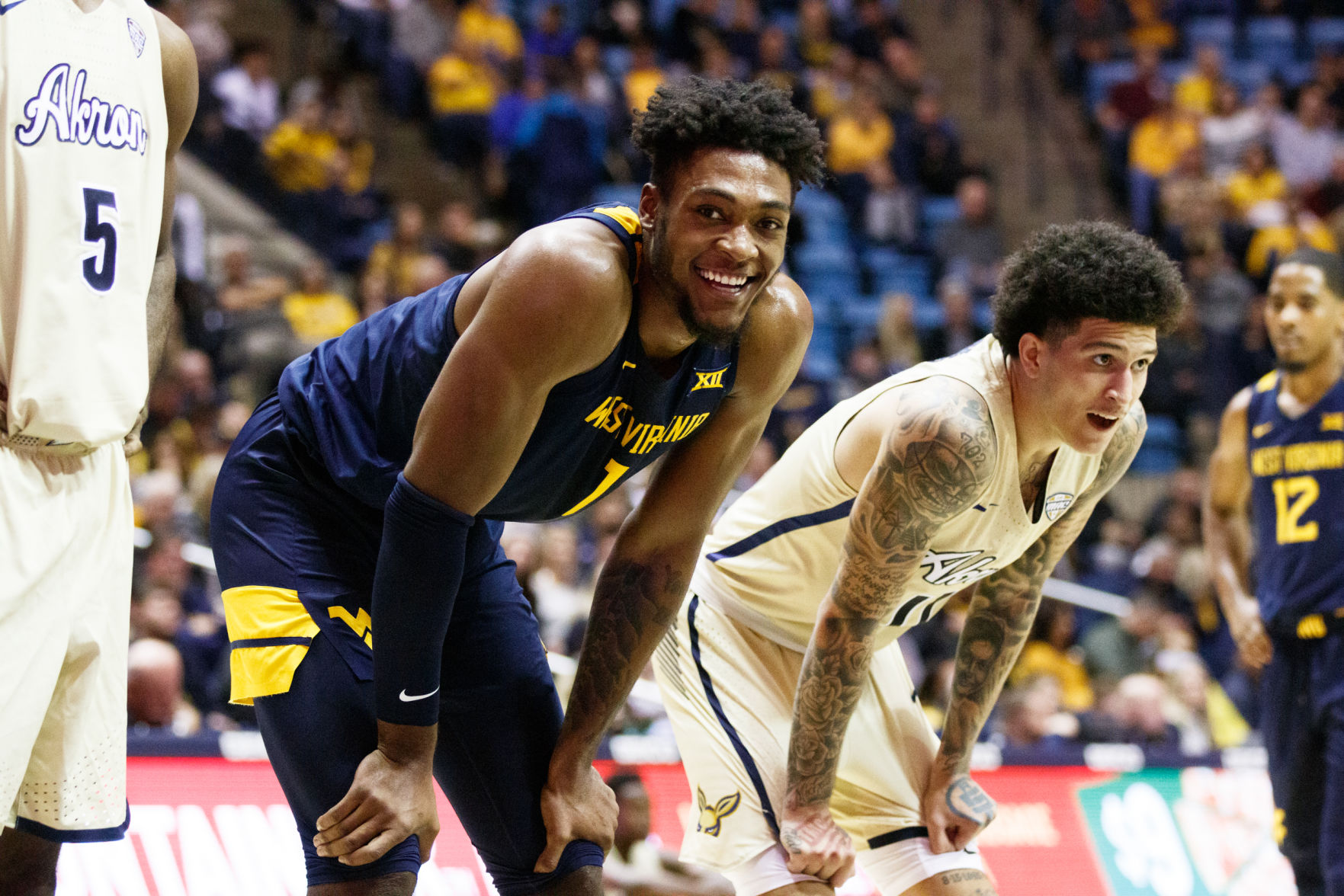 West Virginia's Derek Culver smiles while waiting for a teammate to shoot a free throw during West Virginia's season opener against Akron on Nov. 8, 2019 at the WVU Coliseum.